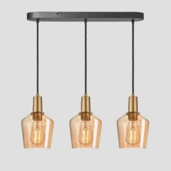 Sleek Tinted Glass Schoolhouse 3 Wire Oval Cluster Lights - 5.5 Inch - Amber -Industville Shop 5.5 Inch Pendant Glass Industville Lighting Schoolhouse BrassHolder Sleek SL TGL SH5 3WOCL A BH