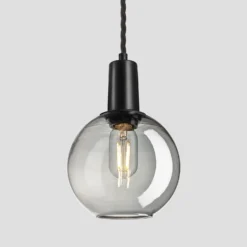 Sleek Tinted Glass Globe Pendant - 7 Inch - Smoke Grey 7 Sleek Tinted Glass Globe Pendant - 7 Inch - Smoke Grey -Industville Shop 7 Inch Pendant TintedGlassSmokeGrey Industville Lighting Globe BlackHolder Sleek SL TGL GLP7 SG BKH w