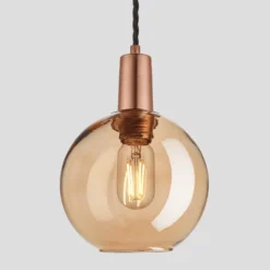 Sleek Tinted Glass Globe Pendant - 7 Inch - Amber -Industville Shop 7 Inch Pendant Tinted Glass Amber Globe Copper Sleek SL TGL GLP7 A CH Lit