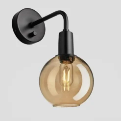 Sleek Tinted Glass Globe Wall Light - 7 Inch - Amber 15 Sleek Tinted Glass Globe Wall Light - 7 Inch - Amber -Industville Shop 7 Inch WallLight Glass Industville Lighting Globe BlackHolder Sleek SL TGL GLWL7 A BKH Angled